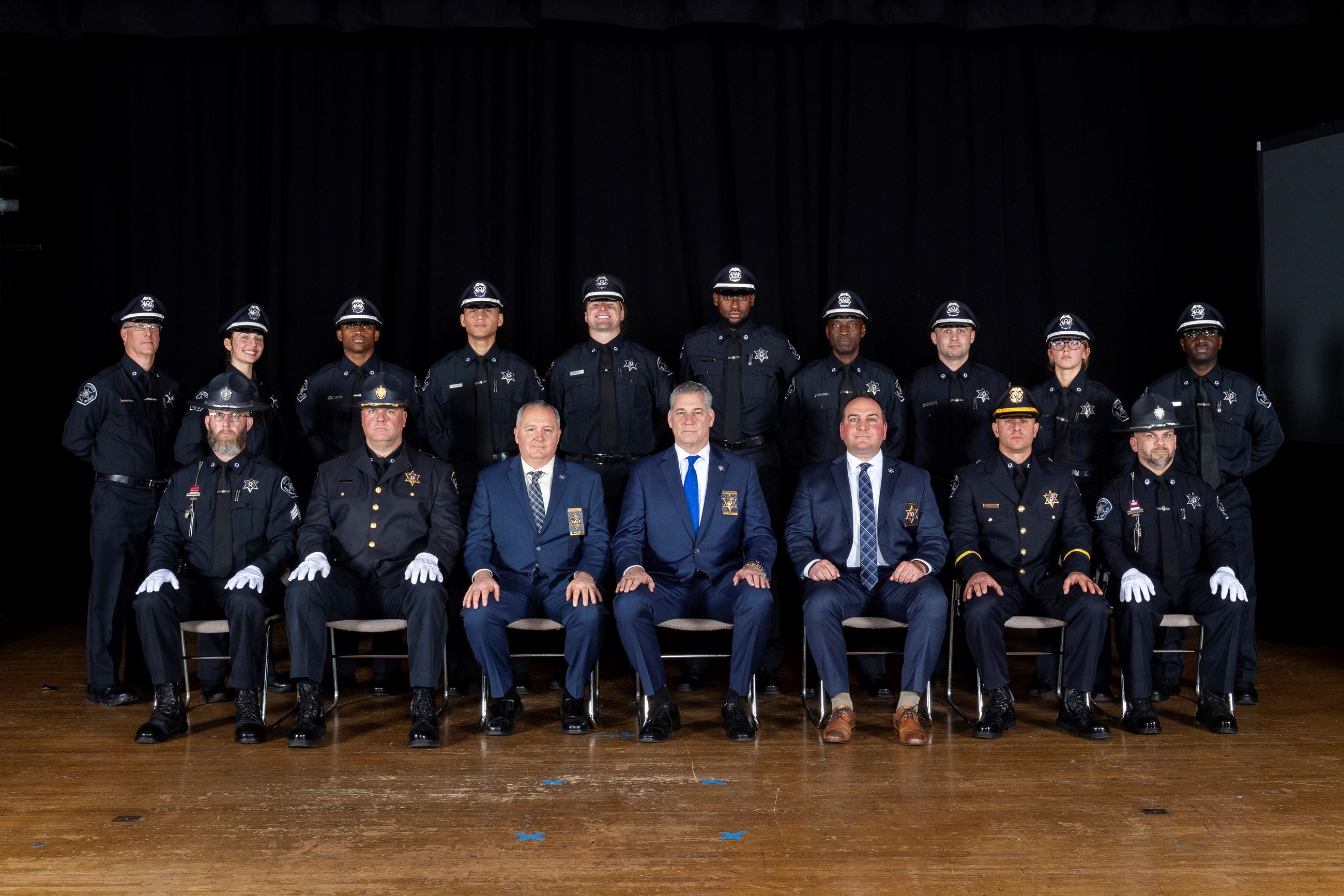 Members of the 53rd Basic Training Academy pose for a photo with command and training staff.
