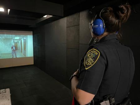 An Arlington Police officer participates in a scenario inside the Middlesex Sheriff's Office Mobile Training Center (MTC)