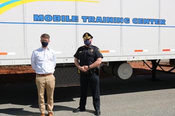 Stoneham Town Administrator Dennis Sheehan (left) and Chief James McIntyre visited with Stoneham police officers conducting interactive, scenario-based training on April 8, 2021.