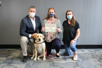   Middlesex Sheriff Peter J. Koutoujian (from left), K-9 Millie, Lowell Community Counseling Director Jillian Ketchen and Vicky Nee of Absolute K-9 Solutions.