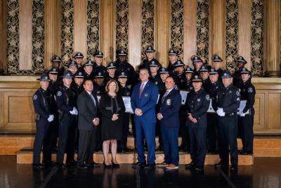 Middlesex Sheriff Peter J. Koutoujian (first row, fourth from right) and former Boston Police Commissioner Kathleen O'Toole (first row, fourth from left) are pictured with graduates of the Middlesex Sheriff's Office (MSO) 46th Basic Training Academy, along with command staff and training academy members following the graduation ceremony at Melrose's Memorial Hall on Friday, Nov. 4, 2022.