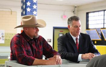 Sheriff Mark Lamb (left) and Sheriff Peter Koutoujian (right) speak with inmates inside the Housing Unit for Military Veterans.
