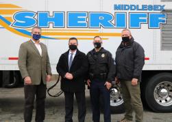 Middlesex Sheriff Peter J. Koutoujian (from left), Tyngsborough Police Chief Richard D. Howe, Tyngsborough Police Sergeant Robert Cote and Middlesex Sheriff’s Office Assistant Deputy Superintendent Gene Massa outside the Middlesex Sheriff’s Office Mobile Training Center (MTC), which members of the Tyngsborough Police Department recently used to complete interactive, scenario-based training.