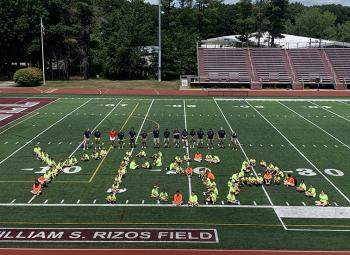 Week 3 participants of the Youth Public Safety Academy spell out YPSA on the field at Lowell's Cawley Stadium at the conclusion of Community Day in late July.